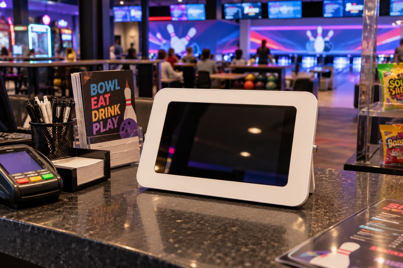 Photograph of the kiosk on a bowling alley counter